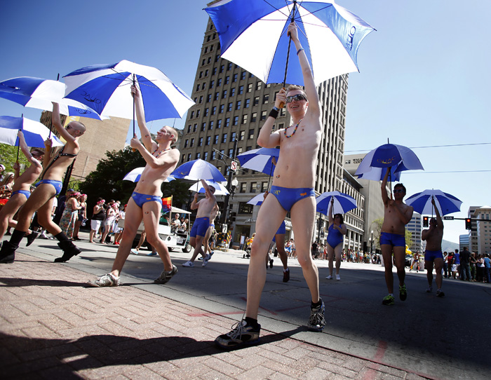 Members of Queer Utah Aquatic Club dance in a gay pride parade in Salt Lake City, Utah, June 2, 2013. Both active Mormons and members of the Boy Scouts marched with members of LGBT community and their supporters as part of the Utah Pride Festival. REUTERS/Jim Urquhart (UNITED STATES)