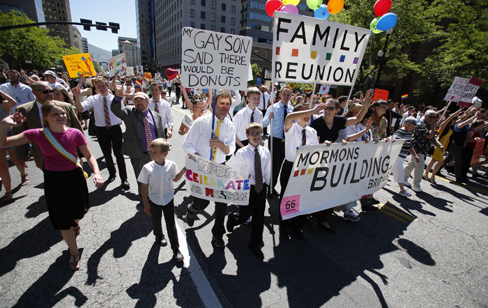 Members of the Mormon church march in a gay pride parade in Salt Lake City, Utah, June 2, 2013. Both active Mormons and members of the Boy Scouts marched with members of LGBT community and their supporters as part of the Utah Pride Festival. REUTERS/Jim Urquhart (UNITED STATES)